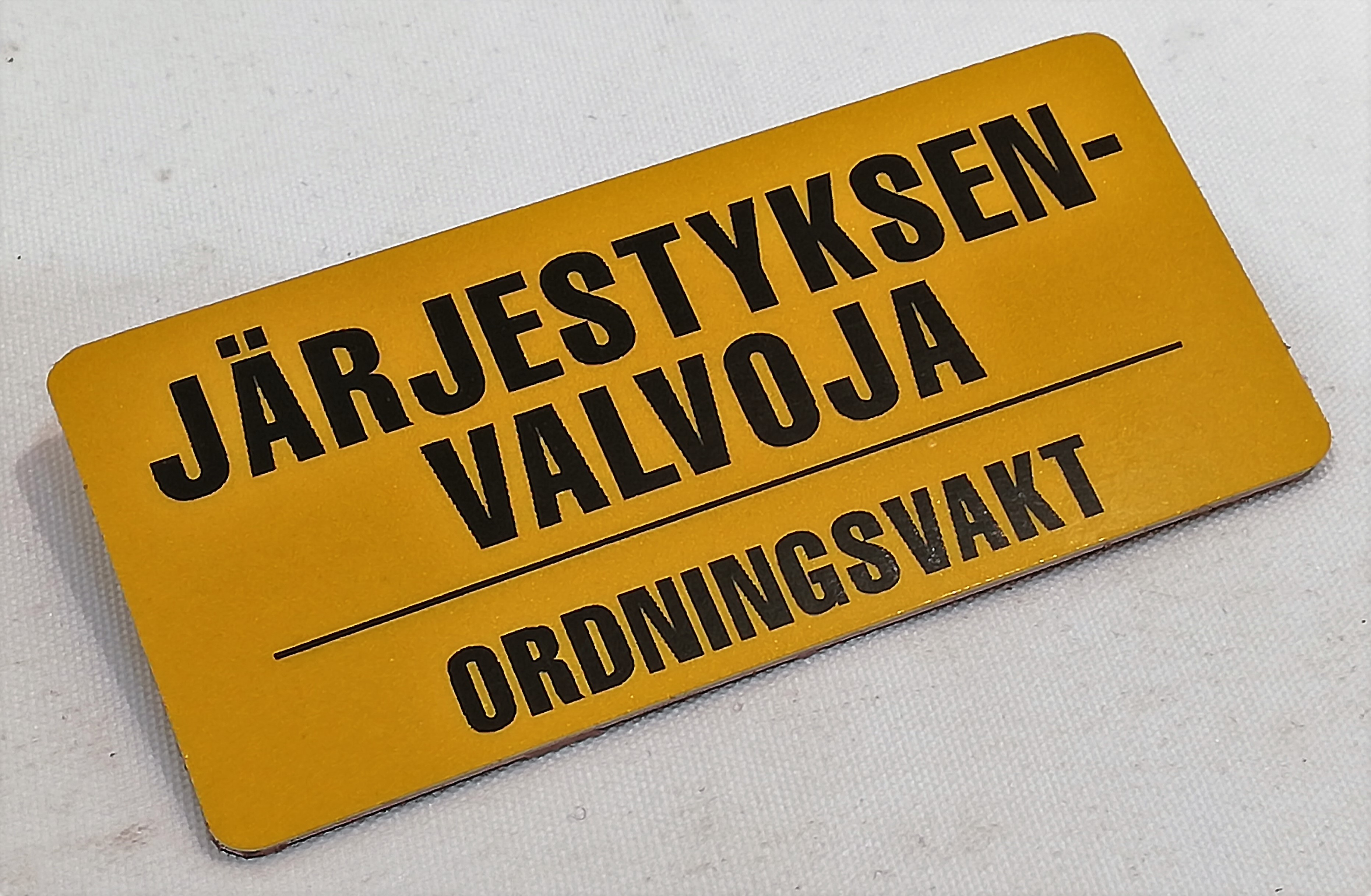 Järjestyksenvalvoja-Ordningsvakt rintalaatta neulakiinnityksellä                                              